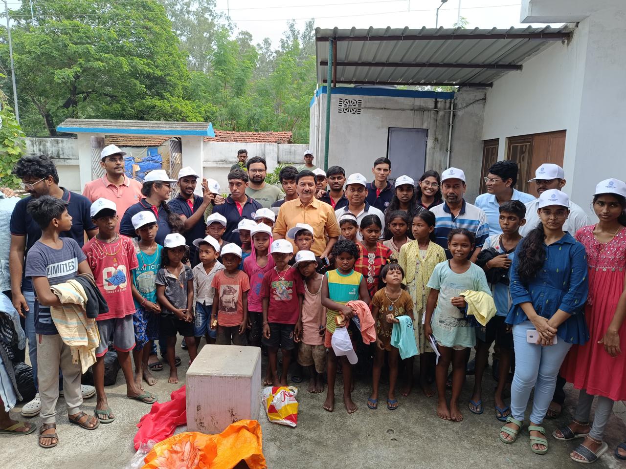 Prof Choubey Distributes Caps, Cakes etc to the Slum Kids